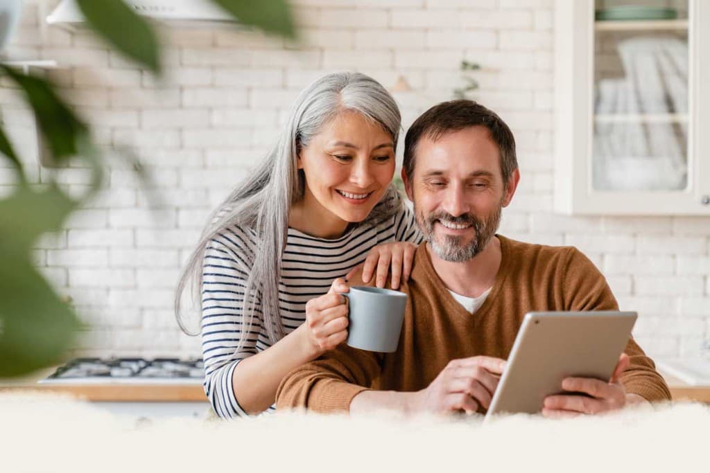 Couple reviewing vacation home options together