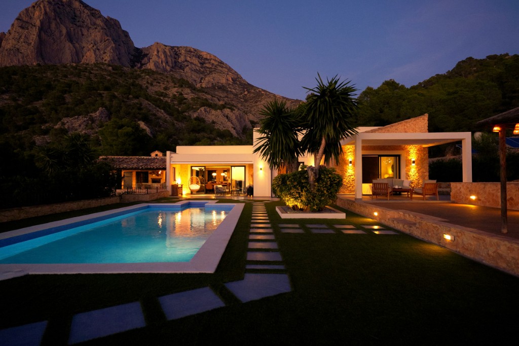 Luxury vacation home with pool at dusk